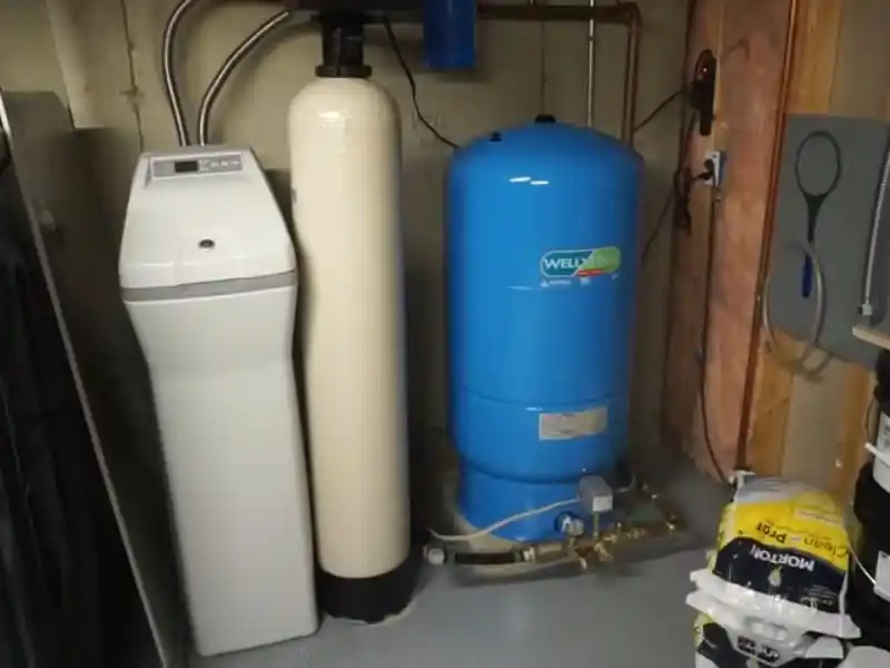 Plumber servicing a residential well pump system in Bonita Springs